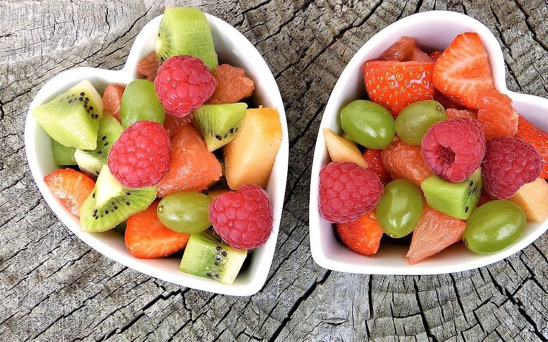 A box of fresh berries and grapes ready for delivery